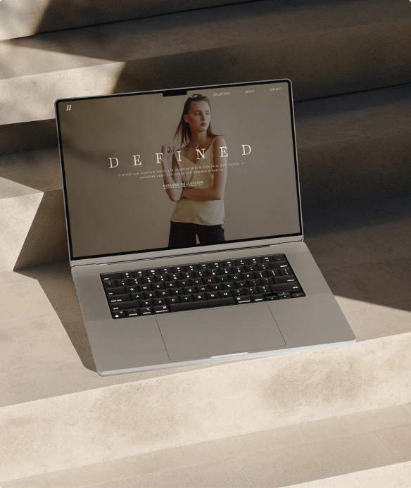 Fashion website shown on a laptop in warm sunlight