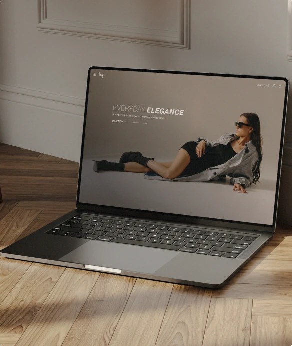 Fashion website displayed on a laptop