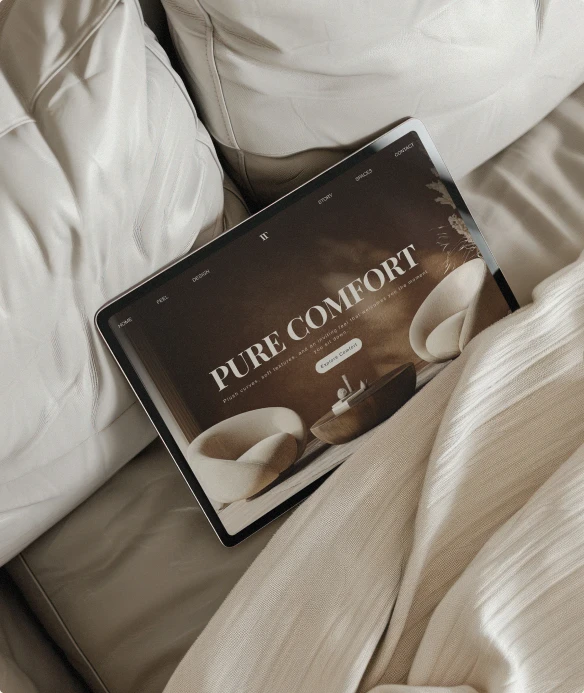 Coffee brand website shown on a laptop on a bed